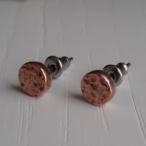 Rough hammered copper stud earrings.