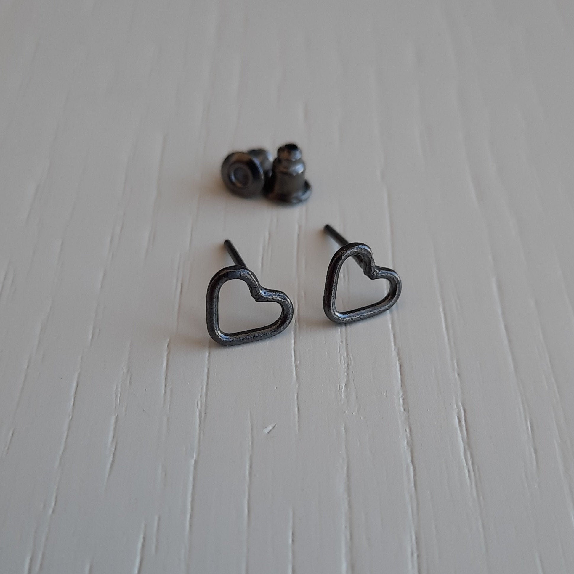 Silver small black heart stud earrings. Etsy