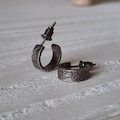 Hammered silver hoop earrings. product logo