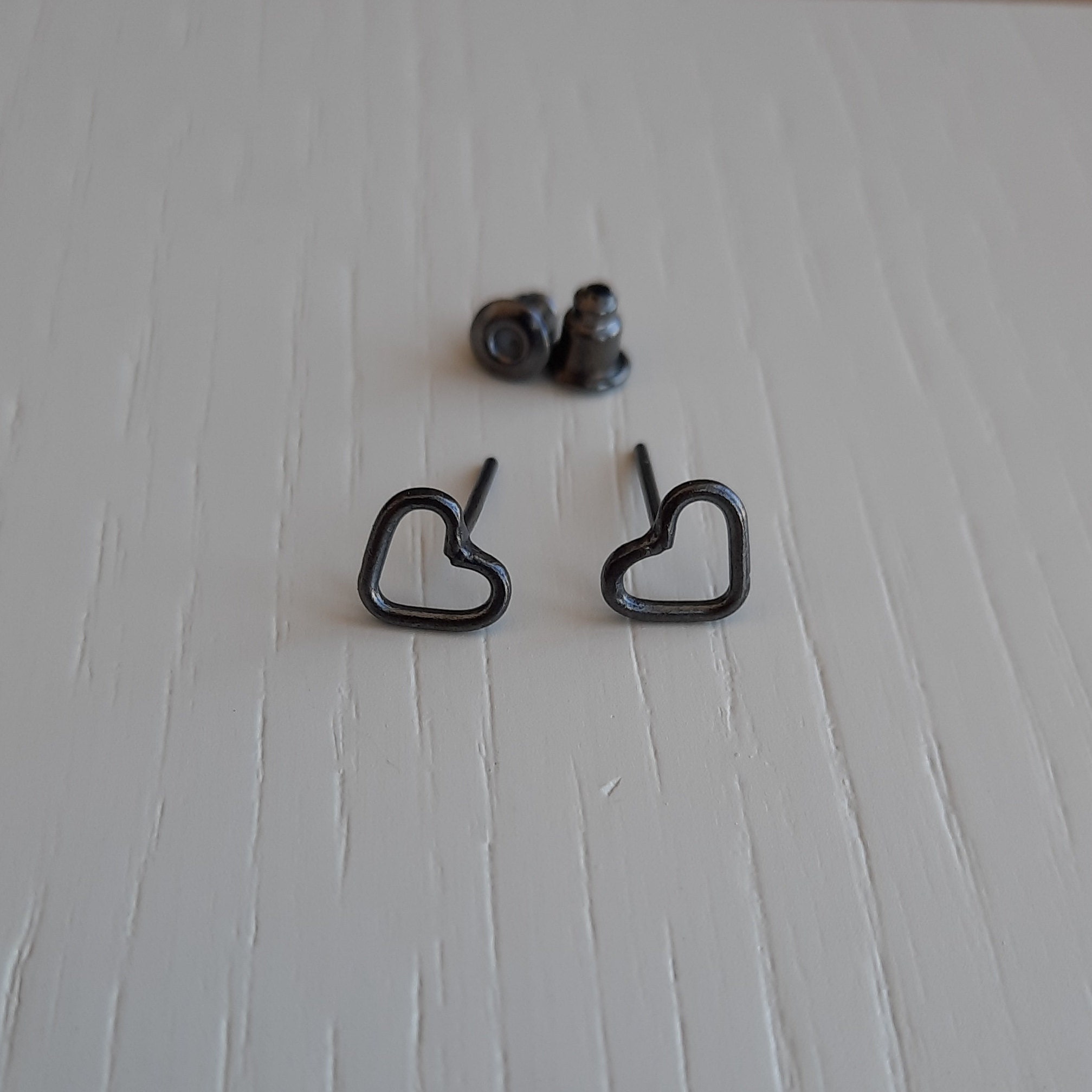 Silver small black heart stud earrings. Etsy