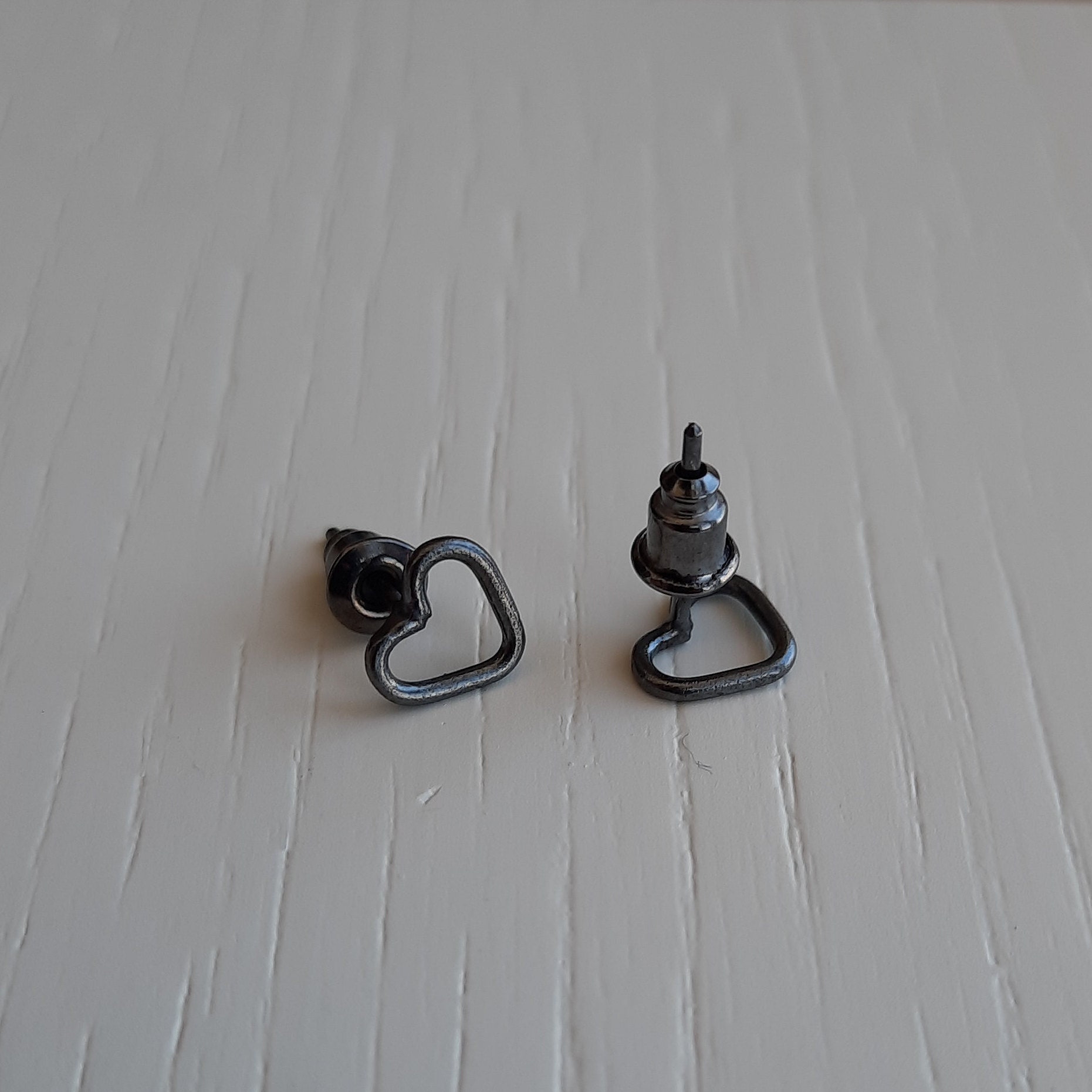 Silver small black heart stud earrings. Etsy