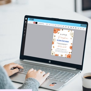 May include: A laptop displays a baby shower invitation design with pumpkins and fall foliage. The text reads "A Little Pumpkin is on the Way!" and includes event details. The image also shows the steps: Personalize, Download, Print, Assemble, and Party.