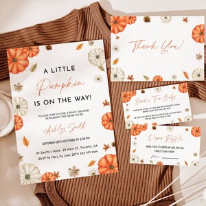 May include: A set of baby shower invitations and cards with a fall theme. The invitation reads "A Little Pumpkin is on the Way!" with details. The cards include "Thank You," "Books For Baby," and "Diaper Raffle." The design features pumpkins, leaves, and floral accents.