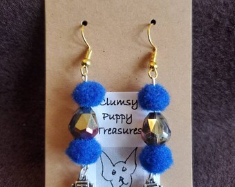 Fun robot earrings with blue pompoms and a flashy bead