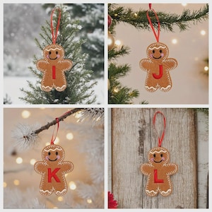 May include: Four gingerbread man ornaments made of brown felt with white stitched icing details, pink cheeks, and a smiling face. Each ornament features a red embroidered letter I, J, K, or L on the chest and hangs from a thin red ribbon loop.