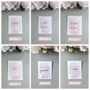 May include: Six rectangular white envelopes containing lottery tickets, each featuring unique black text designs. The designs include phrases like Lucky in Love, The odds are in your favour, and Richer for Poorer, with personalized names and dates printed below.
