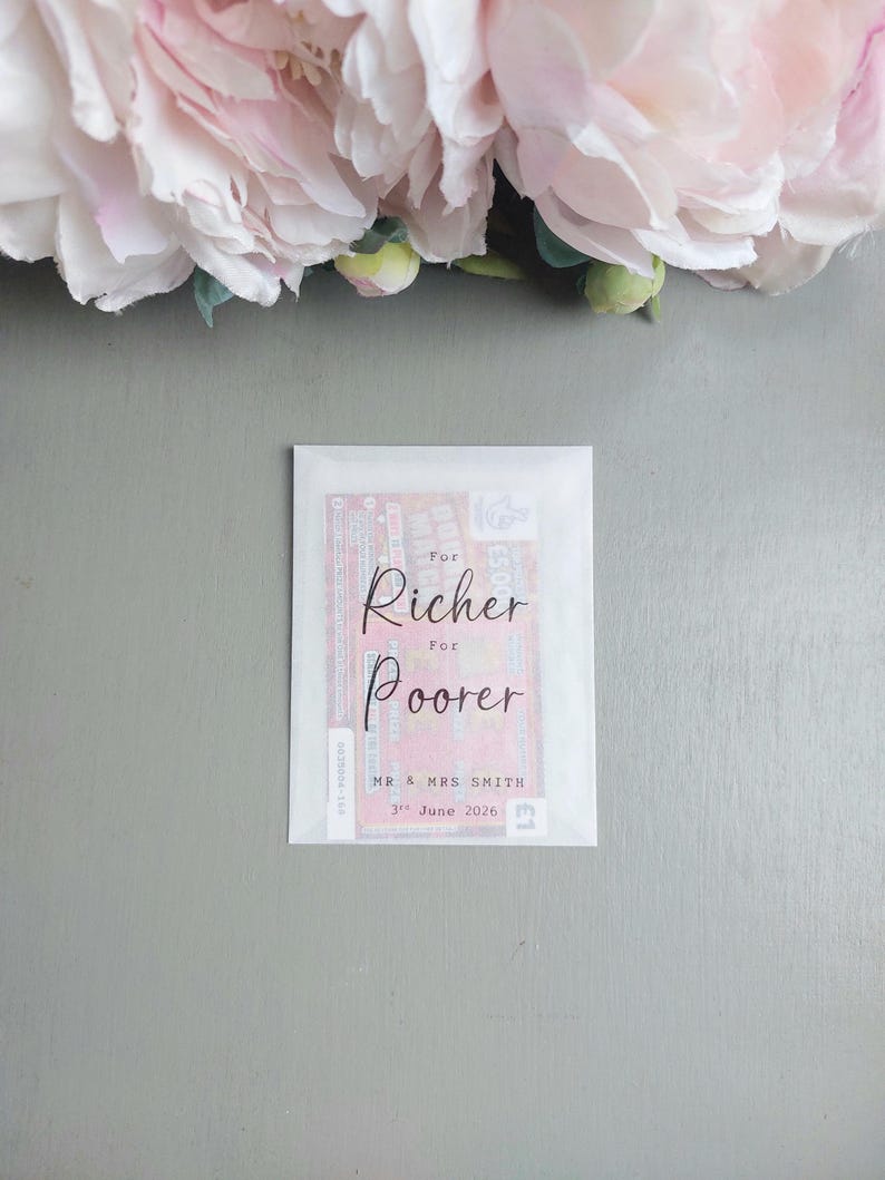 May include: A rectangular white translucent envelope containing a lottery ticket. The front of the envelope features black printed text that reads For Richer For Poorer, MR & MRS SMITH, and 3rd June 2026, with the red lottery ticket visible underneath.