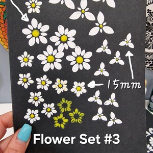 May include: A black card with white daisy and flower designs in two sizes, 2.5 cm and 1.5 cm, labeled "Flower Set #3".