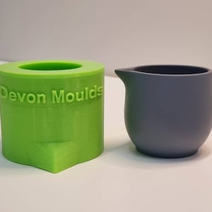 May include: A green silicone mould with the text "Devon Moulds" and a grey silicone jug.