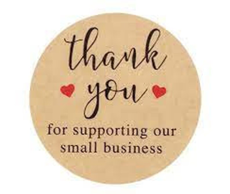 May include: Round, tan sticker with the words "thank you" in elegant script, accompanied by two red heart symbols. Below, the text reads "for supporting our small business."