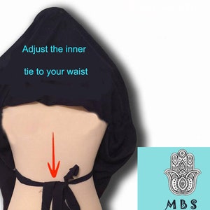 May include: Black fabric wrap with instructions to adjust the inner tie to your waist. An arrow points to the back of the waist where the tie is located.