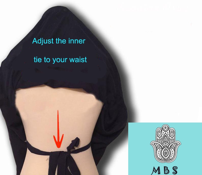 May include: Black fabric wrap with instructions to adjust the inner tie to your waist. An arrow points to the back of the waist where the tie is located.
