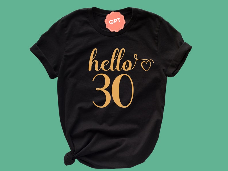 May include: Black t-shirt with gold lettering that says "hello 30" with a small heart.