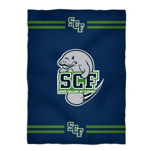 May include: A navy blue fleece blanket with a green and white logo of a manatee and the text "SCF State College of Florida".