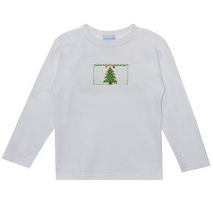 May include: White long-sleeve shirt with a green Christmas tree embroidered on the front. The tree has red, yellow, and orange ornaments.