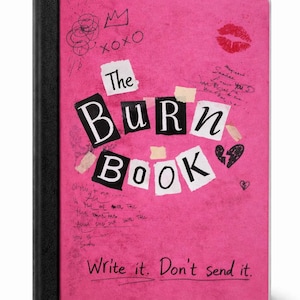 May include: A pink notebook with the words "The Burn Book" in a collage style. The cover features doodles, a kiss mark, and the phrase "Write it. Don't send it."