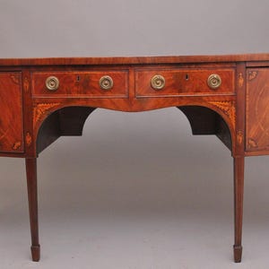 A superb quality Georgian inlaid mahogany bowfront sideboard