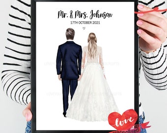 May include: A black framed print with a watercolor illustration of a bride and groom in their wedding attire. The text reads "Mr. & Mrs. Johnson 17th October 2021" and "love personalized".