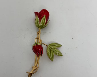 SPILLA Spilla in oro giallo a forma di rosa con al centro diamante