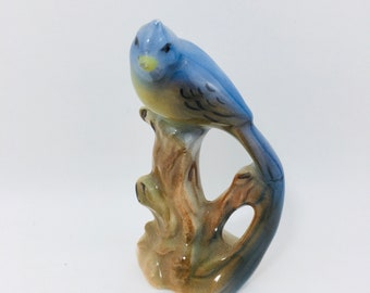 Blue Jay Bird Figurine Sitting On A Tree Stump