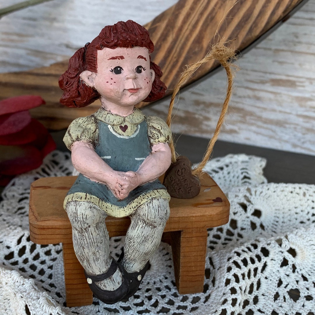 Sarahs Attic Figurine Red Headed Girl With Pigtails Sitting on Wooden