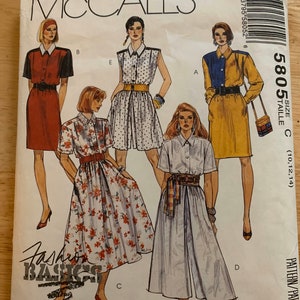 May include: McCall's sewing pattern for a dress and a pair of culottes. The pattern is for sizes 10, 12, and 14. The pattern is called "Fashion Basics" and is petite-able, meaning it can be adjusted for a smaller frame.