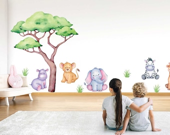 May include: Watercolor wall decals with a savanna theme. The set includes a tree, a lion, an elephant, a zebra, a giraffe, and a hippo. The decals are in soft pastel colours, ideal for a nursery or children's room.