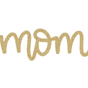 May include: Gold glitter lettering spelling out the word "mom".