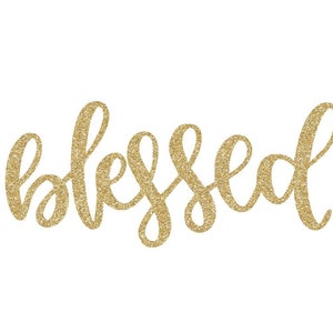 May include: Gold glitter lettering spelling out the word "blessed".