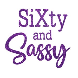 May include: Purple glitter text on a white background reads "Sixty and Sassy". The words are in a playful, cursive font, with the letters filled with sparkling purple glitter.
