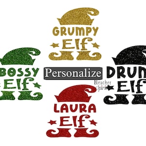 May include: Four different elf designs with glitter accents. The designs include "Grumpy Elf", "Bossy Elf", "Drunk Elf", and "Laura Elf". The text "Personalize" is in the center of the image.