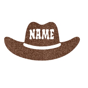 May include: Brown cowboy hat with a white glitter finish and the word "NAME" in white letters.