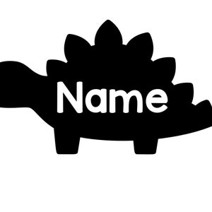 May include: Black silhouette of a dinosaur with the word "Name" written in white inside the body.