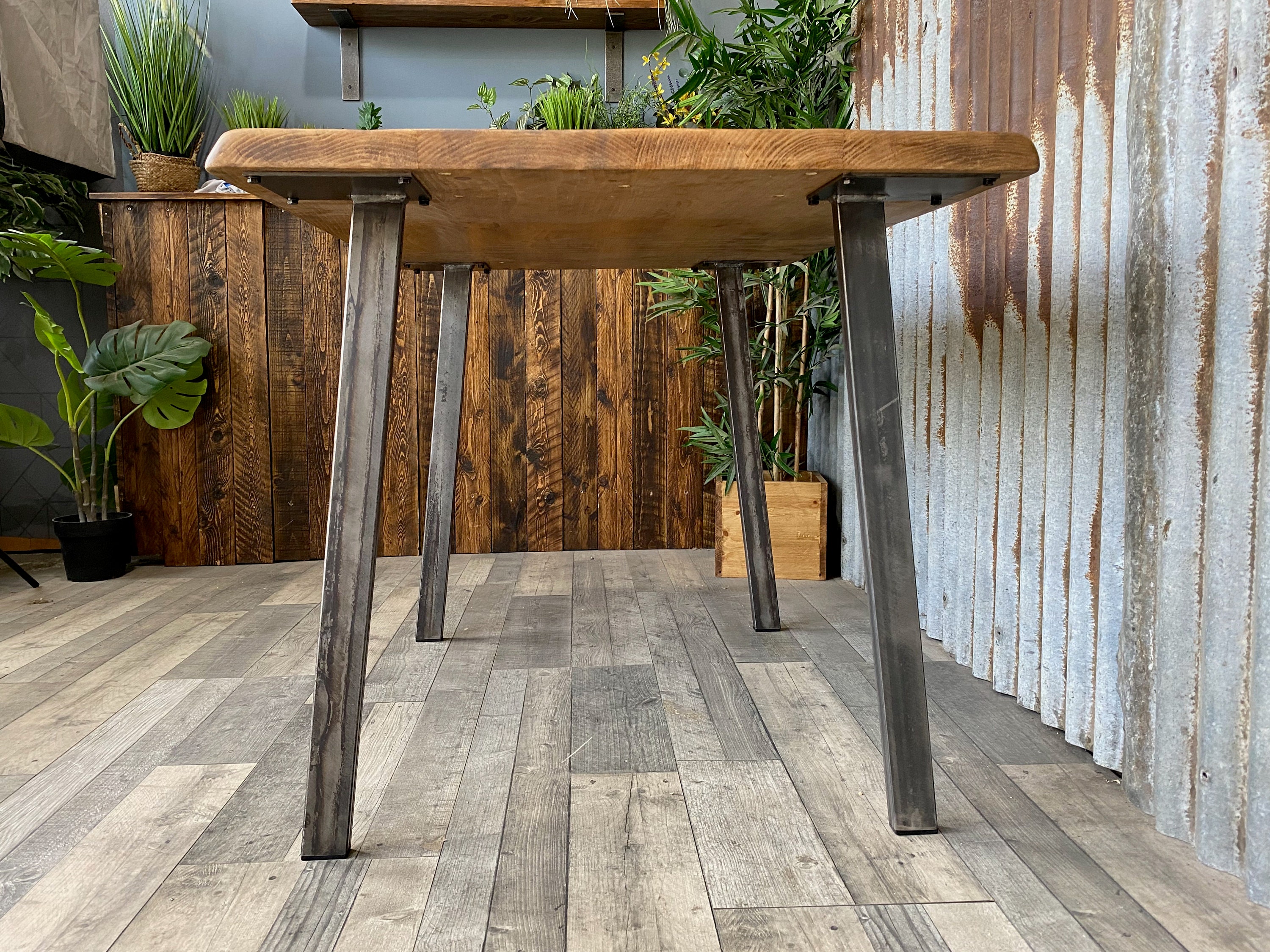 Live edge dining table with angled pin legs, Waney edge rustic
