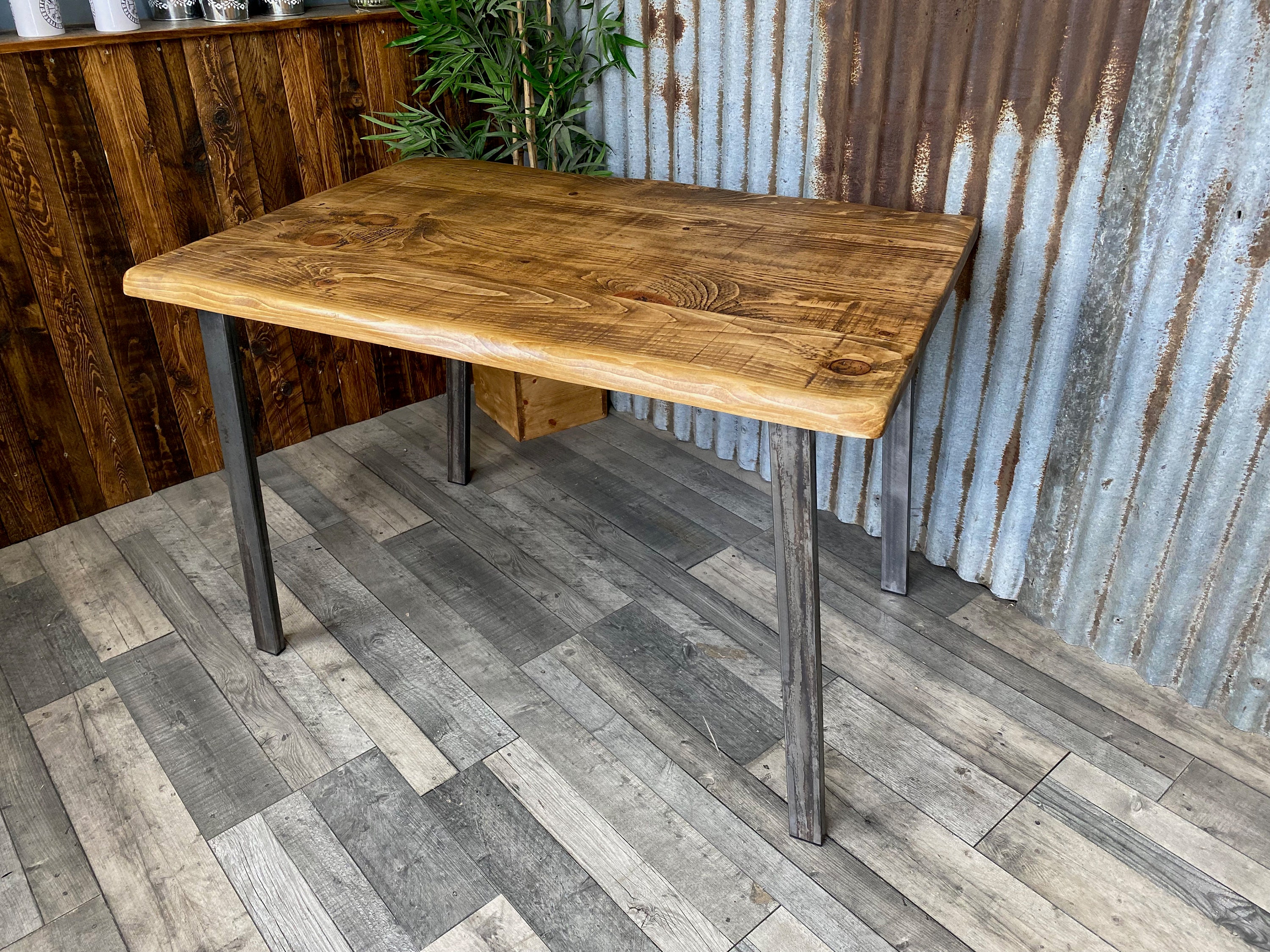 Live edge dining table with angled pin legs, Waney edge rustic