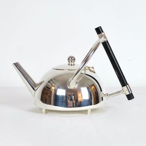 A Silver Art Deco Christopher Dresser Modernist Hemisphere Teapot