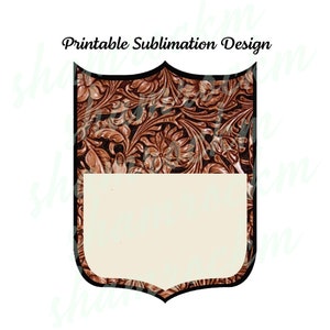 May include: Printable sublimation design featuring a brown leather-like shield with a floral pattern and a blank white rectangle in the center. The shield has a black outline.