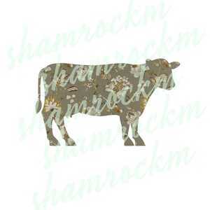 May include: A brown cow silhouette with a floral pattern overlay. The pattern features white, yellow, and brown flowers on a beige background.