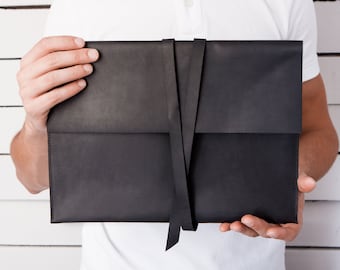 Papel de cuero negro y organizador de documentos con correas