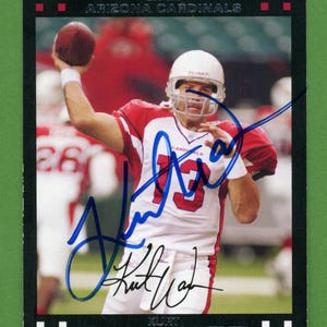 Four Arizona Cardinals football cards signed by former quarterbacks Kurt Warner (NFL Hall of Fame), and 3 others