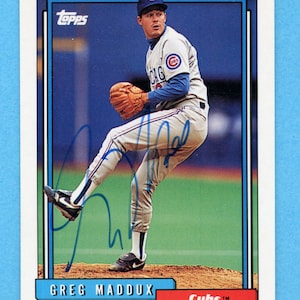 Autographed 1992 Topps Greg Maddux, Chicago Cubs (Plus Yorkis Perez, Bob Scanlan, and Heathcliff Slocumb)