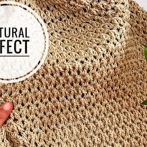 May include: Close-up of a beige crocheted fabric with a textured, open weave pattern. The text "NATURAL EFFECT" is in a white circle. The fabric is a neutral color, and the texture is visible.