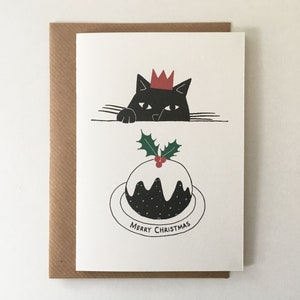 Le Chat Gourmand met Kerstpudding – Kerstkaart Zwarte Kat (blanco van binnen)