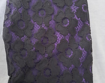 Stoma bag cover er. Black lace on purple/ black 2 in 1 reversible cover. Open ended, stretch back, 9" length