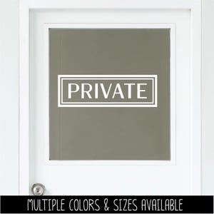 May include: A white rectangular decal with a double-line border and the word PRIVATE in capital letters, applied to the center of a glass pane on a white door with a silver doorknob. The decal features clean lines and bold typography.