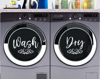 May include: A set of two black washer and dryer door covers with white vinyl lettering that says "Wash" and "Dry" with a heart design.