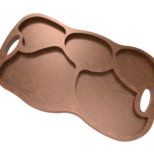 May include: A wooden serving tray with a unique, organic shape and multiple compartments. The tray has two cut-out handles on the sides.