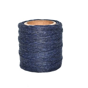 May include: A spool of dark blue waxed thread.