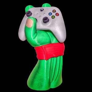 Soporte Turtle para control y auriculares, organizador de escritorio para juegos, soporte acrílico único, regalo ecológico para gamers y entusiastas de la tecnología.