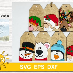 May include: Eight wooden Christmas gift tags with various holiday characters. The characters include a snowman, penguin, polar bear, elf, reindeer, and Santa Claus. The tags are all brown with white edges and have a hole at the top for hanging.